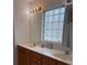 Well-lit bathroom featuring double sinks, a vanity and a large mirror at 232 Moon Dance Ln, Summerville, SC 29483