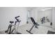 Neutral carpeted room featuring a workout bench and bike, with a mirrored closet at 232 Moon Dance Ln, Summerville, SC 29483
