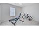 Bright bedroom featuring neutral carpet, a weight bench with dumbbells, and a bicycle at 232 Moon Dance Ln, Summerville, SC 29483