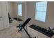 Neutral bedroom with built in mirrors and workout space bathed in natural light at 232 Moon Dance Ln, Summerville, SC 29483