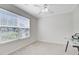 Bedroom featuring a large window, neutral carpet, and ceiling fan at 232 Moon Dance Ln, Summerville, SC 29483