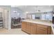 Open-concept kitchen featuring bar seating and a view into the dining and living areas at 232 Moon Dance Ln, Summerville, SC 29483