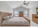 Main bedroom featuring a bed, dresser, TV, and ceiling fan at 232 Moon Dance Ln, Summerville, SC 29483