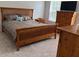 Comfortable bedroom with natural wood furniture, bathed in natural light from a window at 232 Moon Dance Ln, Summerville, SC 29483