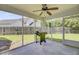 View of a screened porch with a ceiling fan and an outdoor grill at 232 Moon Dance Ln, Summerville, SC 29483