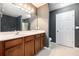 Bright bathroom with wooden cabinets, a large mirror, and a separate walk-in shower at 234 S Lamplighter Ln, Summerville, SC 29486