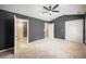 Large bedroom with plush carpet, two closets, and a fan at 234 S Lamplighter Ln, Summerville, SC 29486