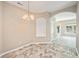 Cozy dining area with tiled floor and elegant lighting fixture at 234 S Lamplighter Ln, Summerville, SC 29486