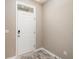 Clean entryway featuring neutral walls, tile flooring, and a classic white door at 234 S Lamplighter Ln, Summerville, SC 29486