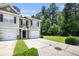 A welcoming townhome featuring a well-kept lawn and a convenient one-car garage at 234 S Lamplighter Ln, Summerville, SC 29486