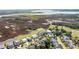 Aerial view showcasing the community's location near marshlands, a golf course, and waterways at 2668 Crooked Stick Ln, Mount Pleasant, SC 29466