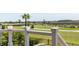 Home balcony overlooking lush golf course with mature palms at 2668 Crooked Stick Ln, Mount Pleasant, SC 29466