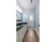 Well-lit bathroom with double sinks, granite counters, white cabinetry, and tile flooring at 2668 Crooked Stick Ln, Mount Pleasant, SC 29466