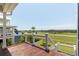 View from the wood deck overlooking the lush golf course and serene landscape at 2668 Crooked Stick Ln, Mount Pleasant, SC 29466