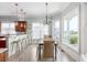 Charming dining area with natural light, pendant lighting, and views of the green landscape at 2668 Crooked Stick Ln, Mount Pleasant, SC 29466