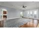 Open-concept living room with hardwood floors and French doors leading to the outdoor space at 2668 Crooked Stick Ln, Mount Pleasant, SC 29466