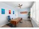 Bright home office with large window, desk, and artistic decor at 2668 Crooked Stick Ln, Mount Pleasant, SC 29466