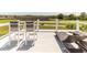 Comfortable rooftop deck with bar stool seating, lounge chairs, and peaceful views at 2668 Crooked Stick Ln, Mount Pleasant, SC 29466