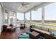 Inviting screened porch with comfortable seating and stunning views of the surrounding landscape at 2668 Crooked Stick Ln, Mount Pleasant, SC 29466