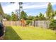Large backyard features a playset and a wood fence for privacy at 2722 Sunrose Ln, Johns Island, SC 29455