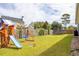 Spacious backyard features a swing set and trampoline at 2722 Sunrose Ln, Johns Island, SC 29455