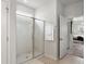 Bathroom with glass enclosed shower and door to main bedroom at 2722 Sunrose Ln, Johns Island, SC 29455