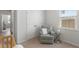 Calm Bedroom with a rocking chair, neutral tones, and ample natural light at 2722 Sunrose Ln, Johns Island, SC 29455