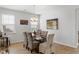 Bright dining area features hardwood flooring, a glass table, wicker chairs, and ample natural light at 2722 Sunrose Ln, Johns Island, SC 29455