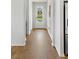 Bright entryway features light walls, wood floors, and a front door view of the outdoors at 2722 Sunrose Ln, Johns Island, SC 29455