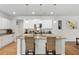 Stylish kitchen features an island with seating, granite countertops, and stainless steel appliances at 2722 Sunrose Ln, Johns Island, SC 29455