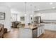 Bright, open kitchen with a granite island, stainless steel appliances, and an adjacent dining area at 2722 Sunrose Ln, Johns Island, SC 29455