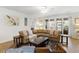 Bright living room featuring a woven sectional, hardwood floors, and natural light from sliding glass doors at 2722 Sunrose Ln, Johns Island, SC 29455