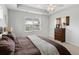 Neutral main bedroom features a ceiling fan and views of the neighborhood at 2722 Sunrose Ln, Johns Island, SC 29455