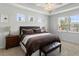 Bright main bedroom with large windows, ceiling fan, and ensuite bath at 2722 Sunrose Ln, Johns Island, SC 29455