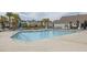 Large community pool with lounge chairs and palm trees at 2722 Sunrose Ln, Johns Island, SC 29455