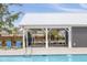 Community pool with covered picnic area, lounge chairs, and clear blue water on a sunny day at 2722 Sunrose Ln, Johns Island, SC 29455