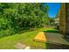 Lush backyard featuring mature trees, well-maintained lawn, and a freshly built wooden deck at 2847 Limestone Blvd, Charleston, SC 29414