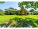 View of the back of the property featuring a spacious yard and brick exterior at 2847 Limestone Blvd, Charleston, SC 29414