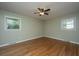 Spacious bedroom featuring hardwood floors, two windows and neutral paint color at 2847 Limestone Blvd, Charleston, SC 29414