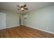 Bedroom featuring hardwood floors, a window, and neutral paint with door to bathroom at 2847 Limestone Blvd, Charleston, SC 29414