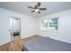 Bright bedroom with wood floors, a ceiling fan, and a closet with mirrored doors at 2847 Limestone Blvd, Charleston, SC 29414