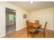 Charming dining area featuring hardwood floors, a round wood table and four chairs at 2847 Limestone Blvd, Charleston, SC 29414