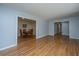 Open living space with hardwood floors leading to a well-lit dining area with a table set at 2847 Limestone Blvd, Charleston, SC 29414