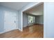 Inviting entryway with hardwood floors and a view into a bright living room at 2847 Limestone Blvd, Charleston, SC 29414