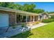 Charming brick home with a lovely front porch, rocking chairs, and a well-manicured lawn at 2847 Limestone Blvd, Charleston, SC 29414