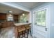 Kitchen area with granite countertops, stainless appliances, breakfast bar, and access to the back yard at 2847 Limestone Blvd, Charleston, SC 29414