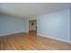 Hardwood floors in a spacious living room that transitions to other rooms in the home at 2847 Limestone Blvd, Charleston, SC 29414