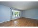 Spacious living room featuring hardwood floors and large windows with backyard views at 2847 Limestone Blvd, Charleston, SC 29414