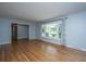 Bright living room with hardwood floors and large windows offering pleasant neighborhood views at 2847 Limestone Blvd, Charleston, SC 29414