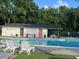 Community pool with bath house and lounge chairs with lush greenery and picnic tables at 2847 Limestone Blvd, Charleston, SC 29414
